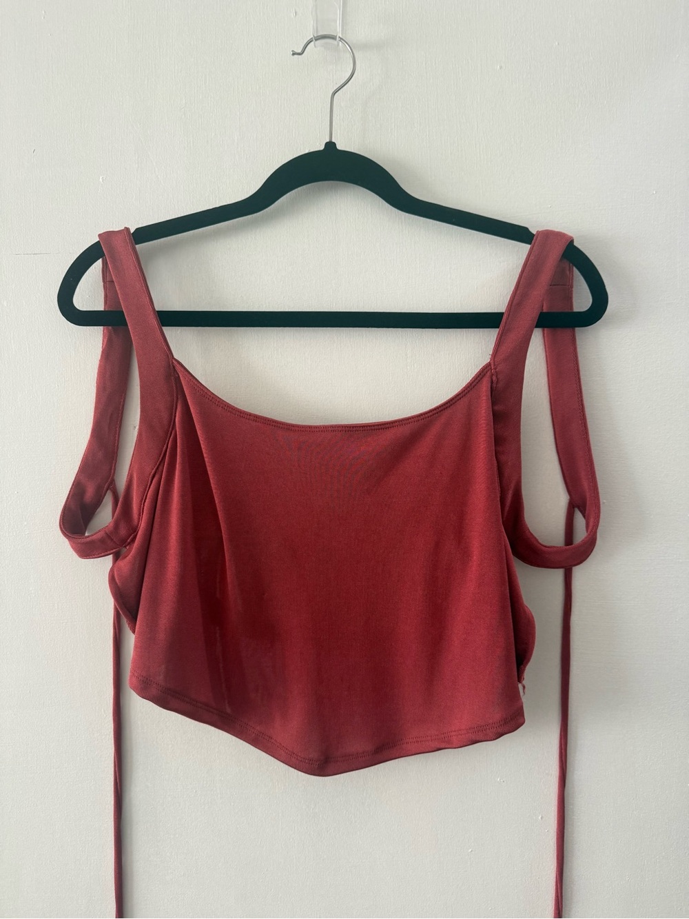 Women’s maroon open tie back crop top.